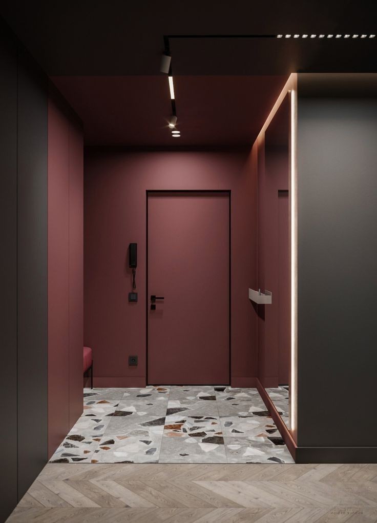 Interior painting in Aurora — burgundy hallway with terrazzo floor and white trim
