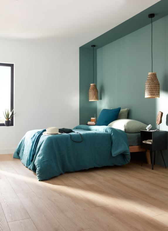 Interior painting in Barrie — teal bedroom accent wall with white trim