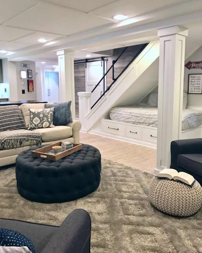 Finished luxury basement lounge with pool table, stone fireplace and reclaimed wood wall
