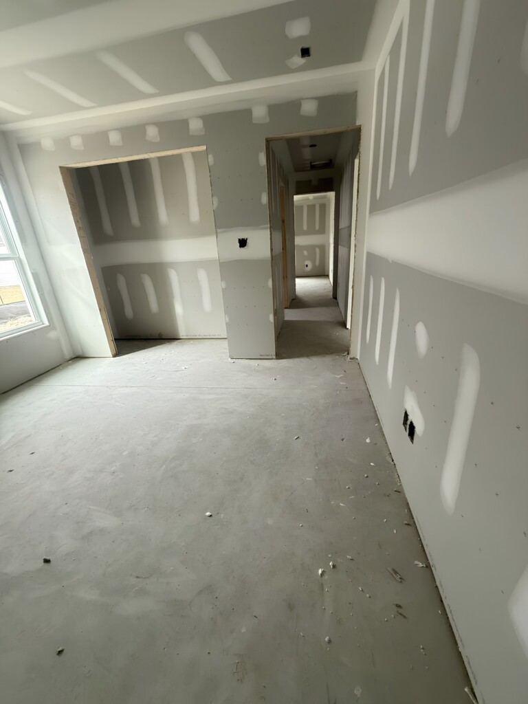 New-build hallway with freshly installed drywall