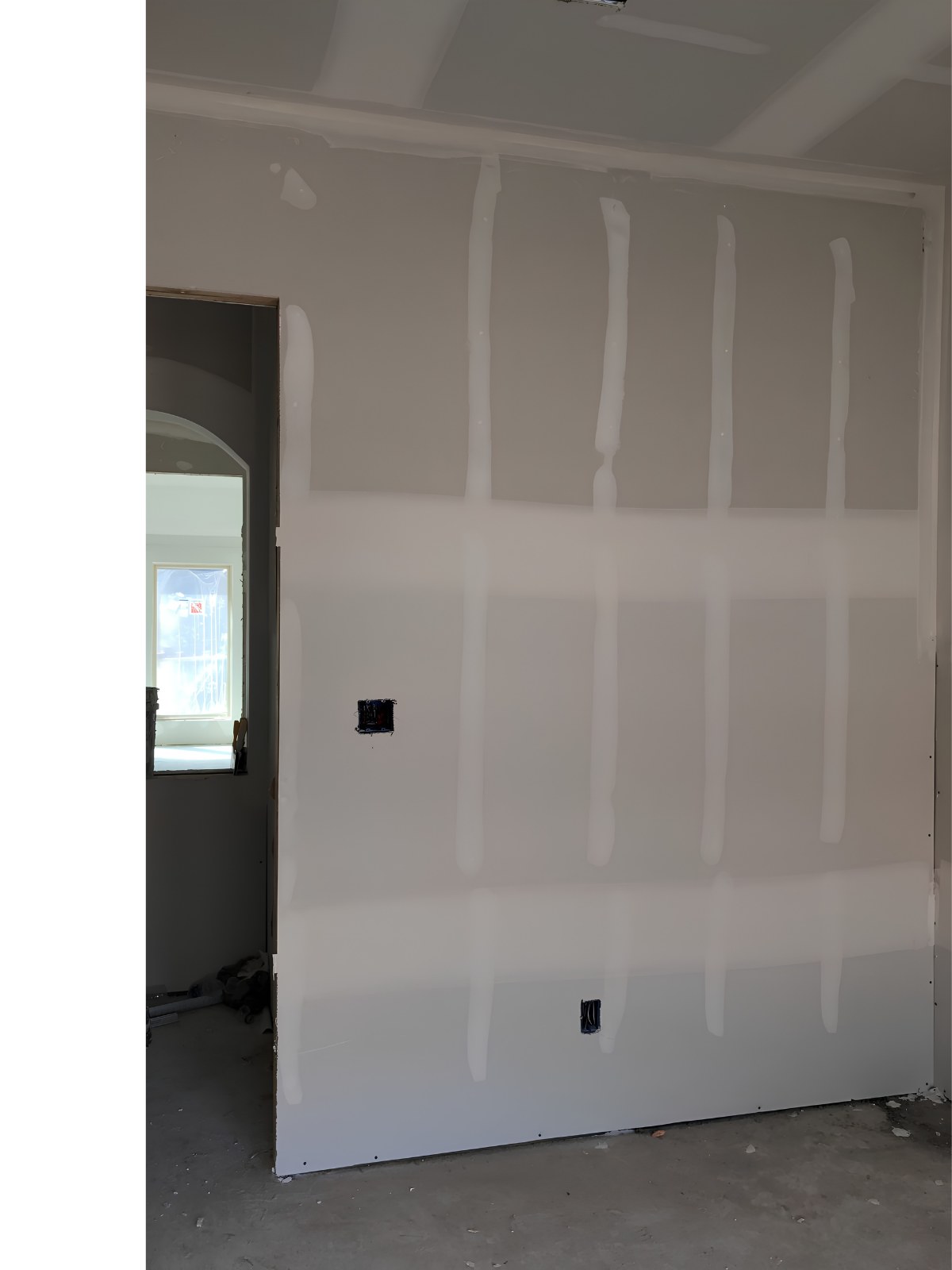 Drywall installation in Perth County — taped drywall feature wall beside a doorway