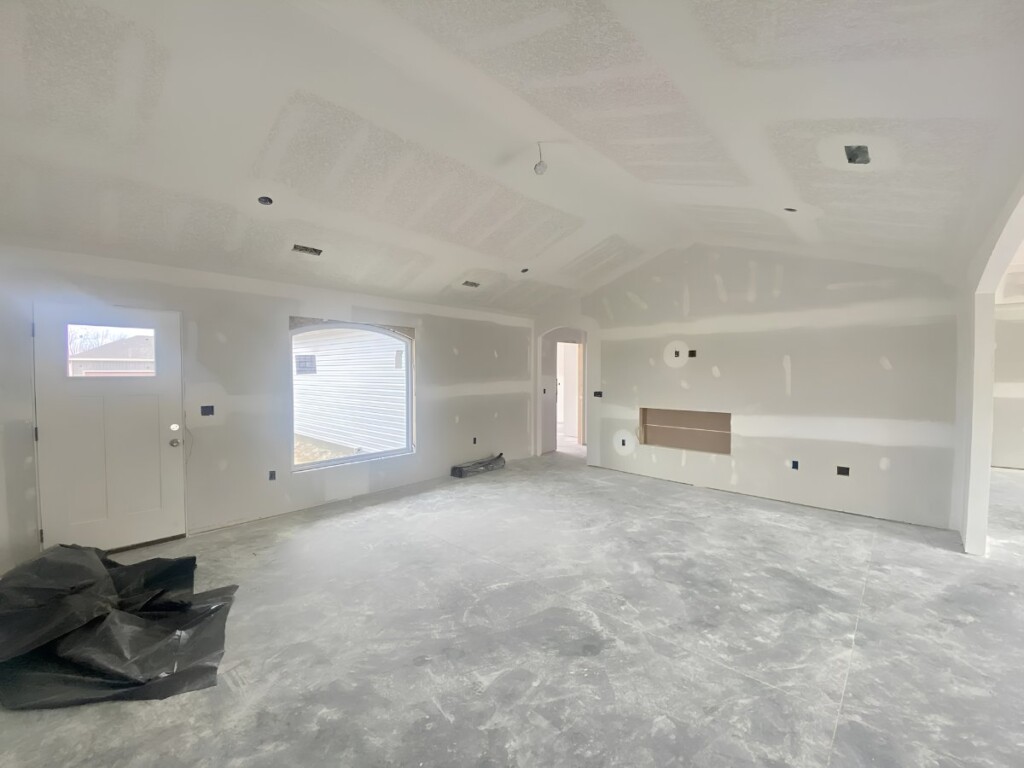 Vaulted living room finished in drywall