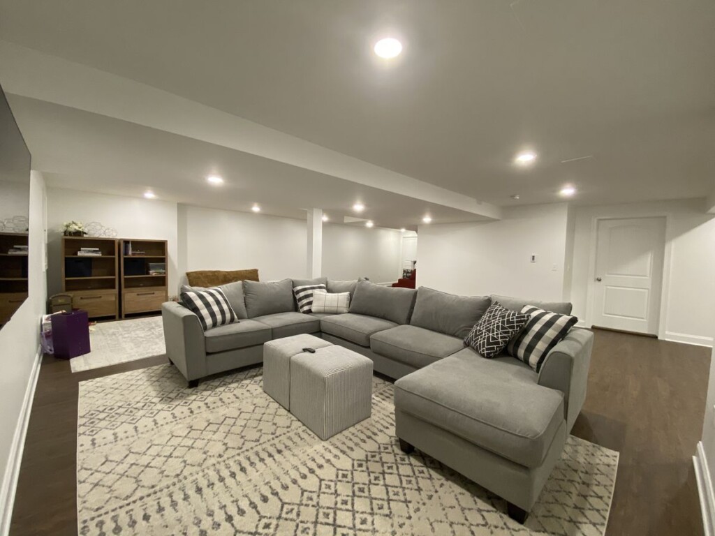Basement rec room with a sectional sofa