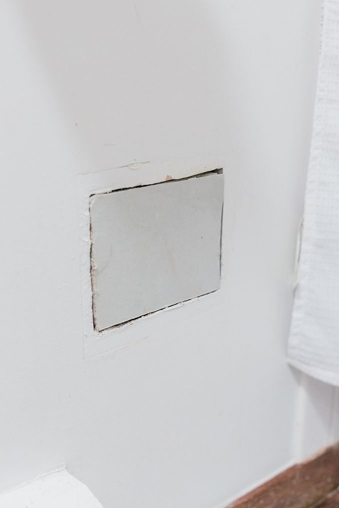 New drywall patch fitted flush before taping in a Halton home