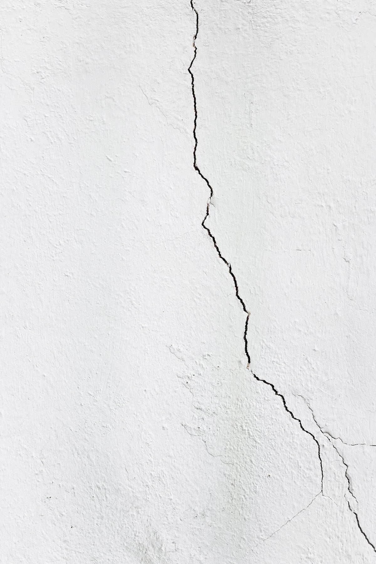 Cracked plaster wall showing moisture movement in a Niagara home in Niagara Region